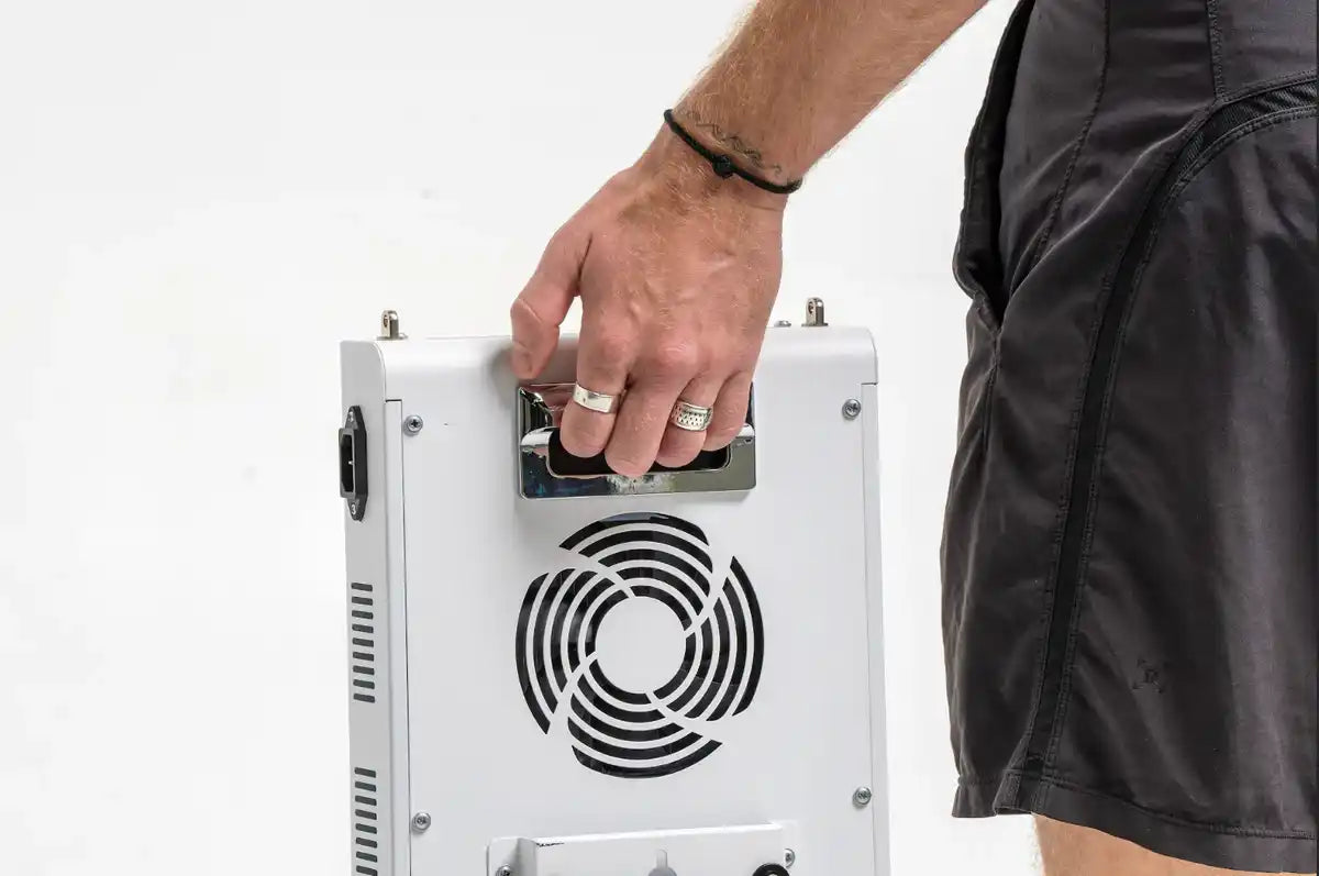 Person carrying a RedRush PULSE panel by the rear handle